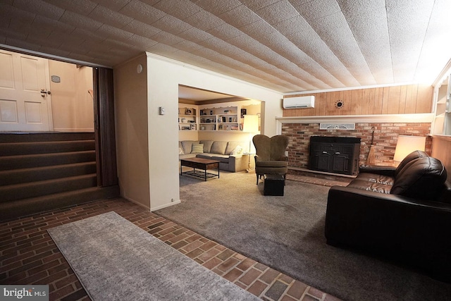 carpeted living room featuring wooden walls, a fireplace, and an AC wall unit