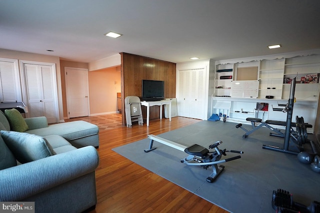 exercise room featuring light hardwood / wood-style floors