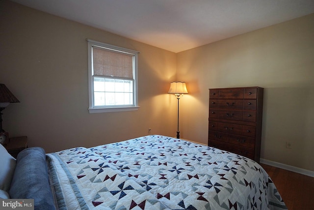 bedroom with hardwood / wood-style flooring