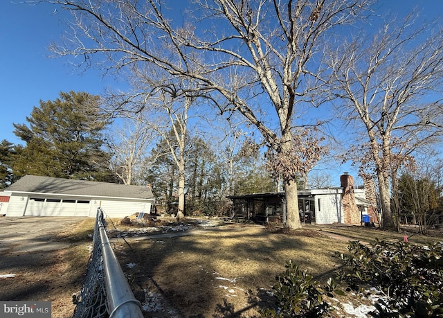 view of yard with an outbuilding and a garage