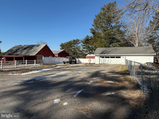 view of property exterior featuring an outbuilding