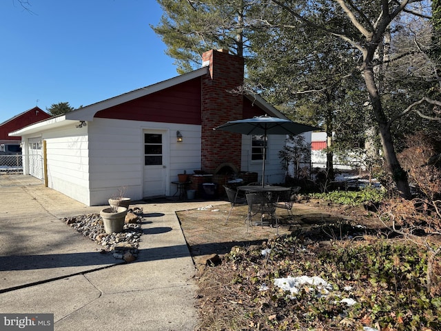 back of property featuring a patio area