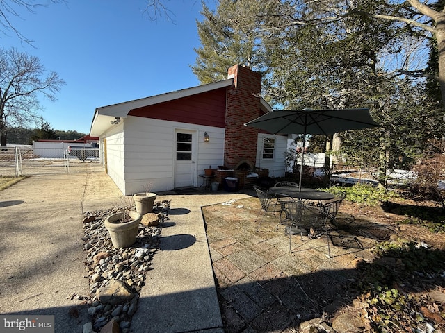 back of property featuring a patio