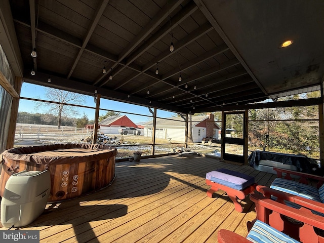 wooden terrace with a hot tub