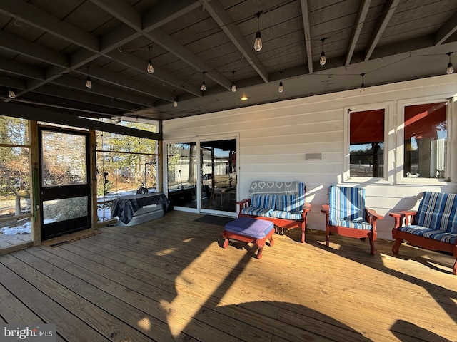 unfurnished sunroom with wood ceiling and beam ceiling