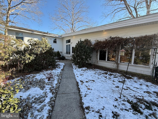 view of snow covered property