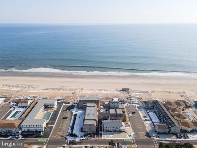 bird's eye view with a beach view and a water view