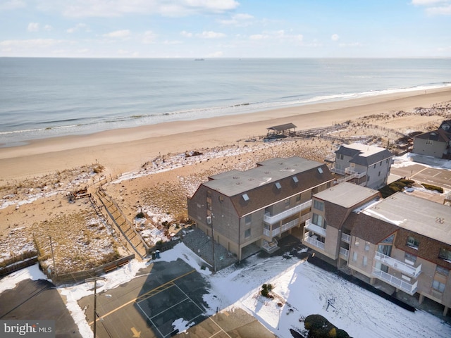 drone / aerial view with a water view and a view of the beach