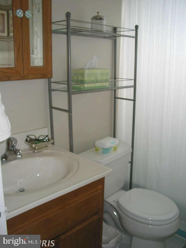 bathroom with vanity and toilet