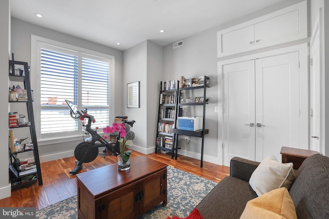 living room with dark hardwood / wood-style floors