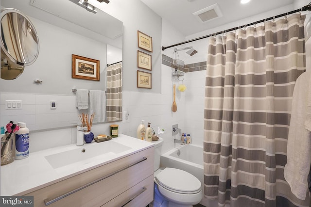 full bathroom featuring tile walls, vanity, toilet, and shower / bathtub combination with curtain