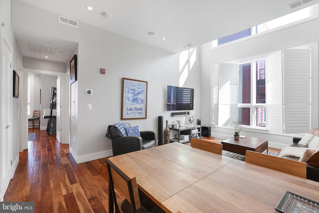 dining space featuring dark wood-type flooring