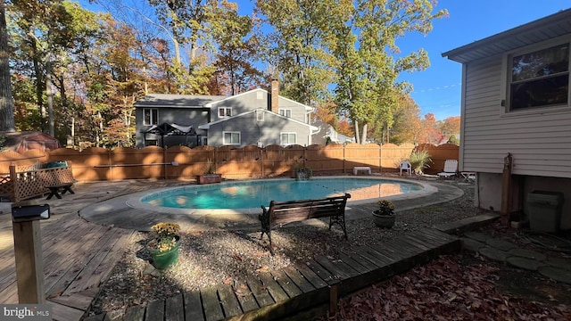 view of pool featuring a wooden deck