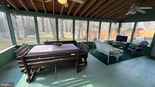 sunroom featuring ceiling fan and lofted ceiling