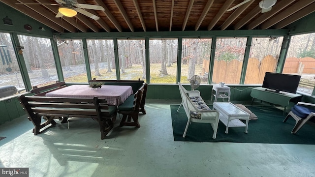 sunroom / solarium with vaulted ceiling