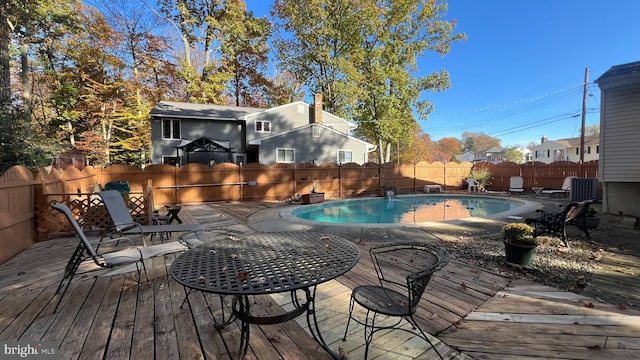 view of pool featuring a wooden deck