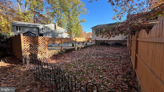 view of yard with a fenced in pool and a patio area