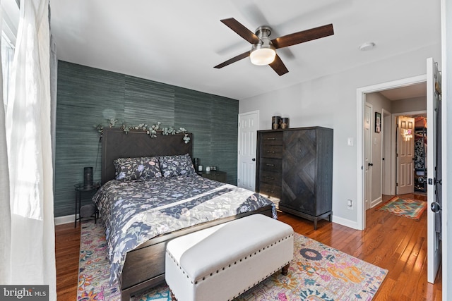 bedroom featuring ceiling fan and wood-type flooring