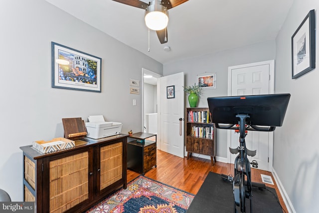 home office with ceiling fan and wood-type flooring