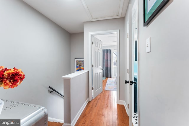 hall with light hardwood / wood-style floors