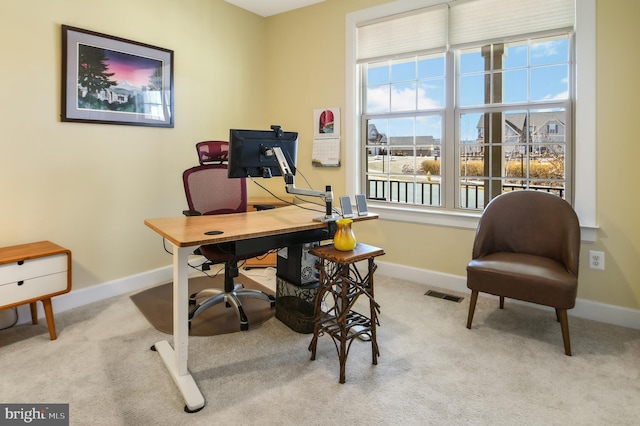 office area featuring carpet floors, visible vents, and baseboards