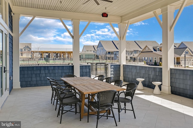 view of patio with a residential view and outdoor dining space