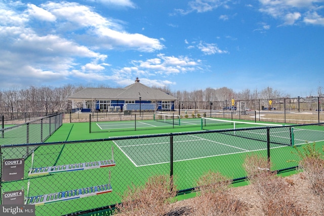 view of sport court featuring fence