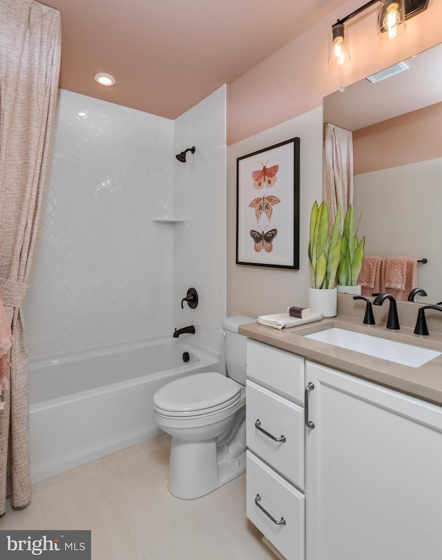 full bathroom featuring vanity, toilet, and tiled shower / bath