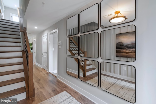 stairway with wood-type flooring