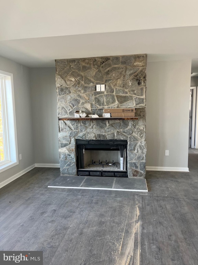 interior details featuring a fireplace and hardwood / wood-style flooring