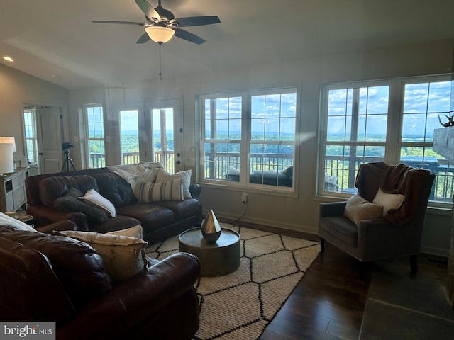 living room with ceiling fan and dark wood-type flooring