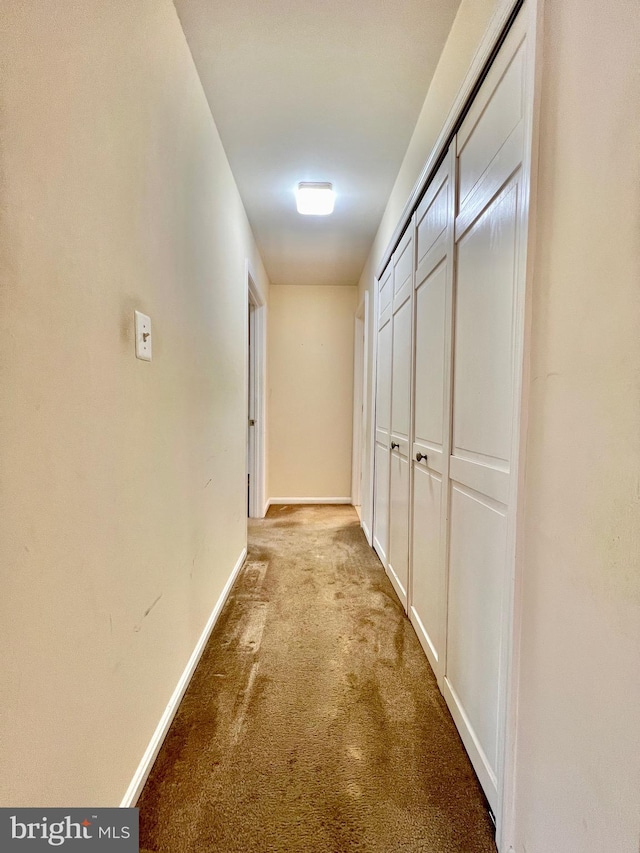 hallway featuring light carpet