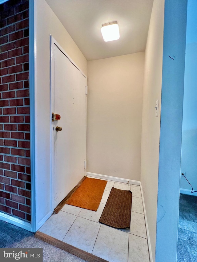 interior space with light tile patterned floors