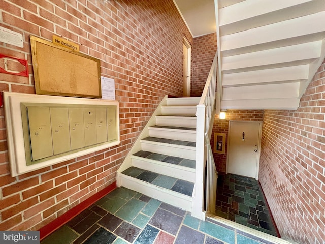 staircase featuring mail boxes