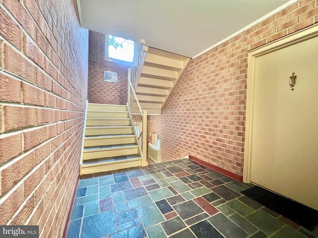 stairway with brick wall