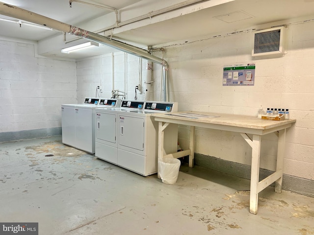 clothes washing area featuring washing machine and clothes dryer