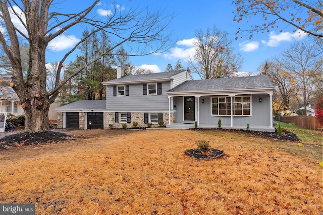 split level home featuring a front lawn