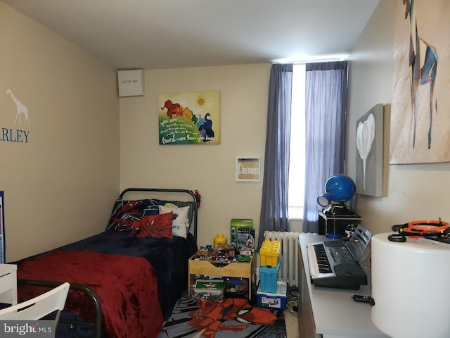 bedroom featuring radiator