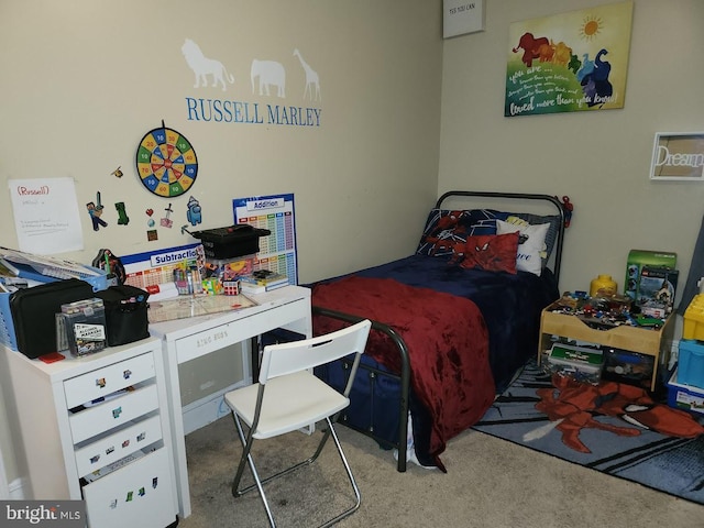 bedroom featuring light colored carpet