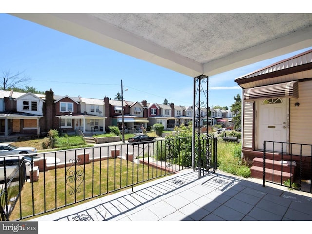 view of patio with a balcony