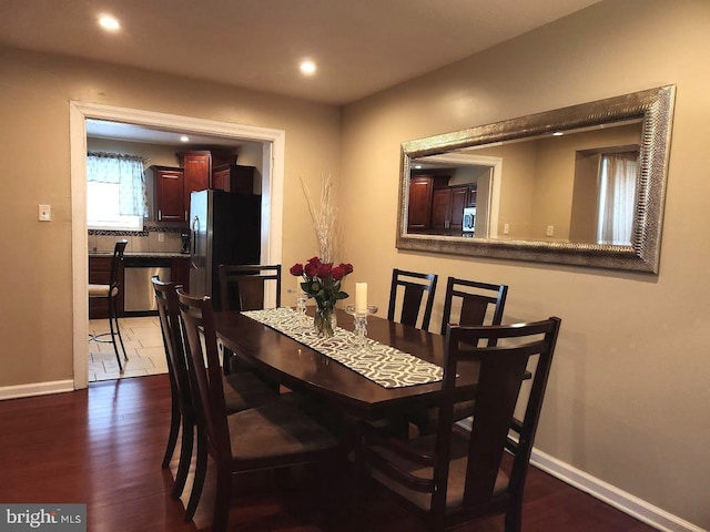 dining room with dark wood-type flooring