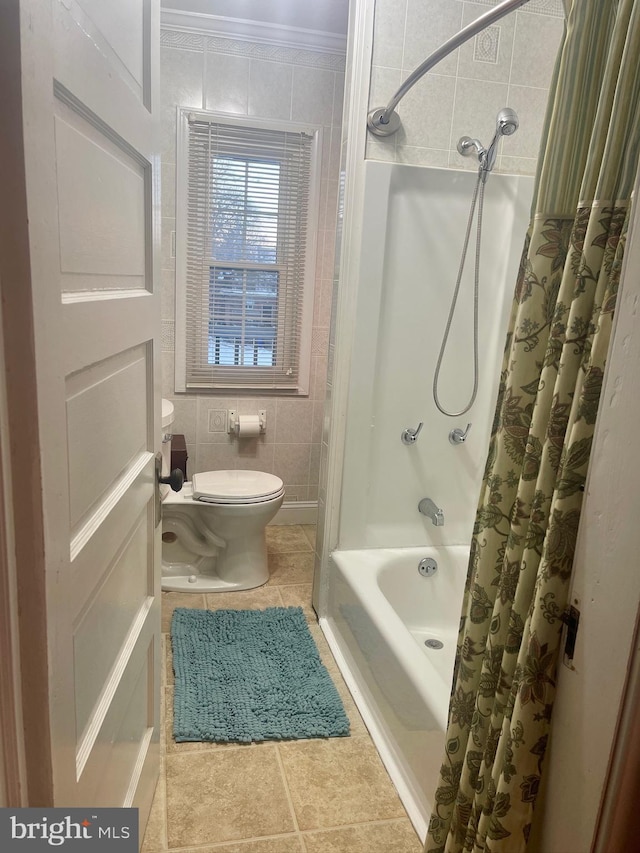 bathroom featuring shower / bath combination with curtain, ornamental molding, tile walls, tile patterned flooring, and toilet