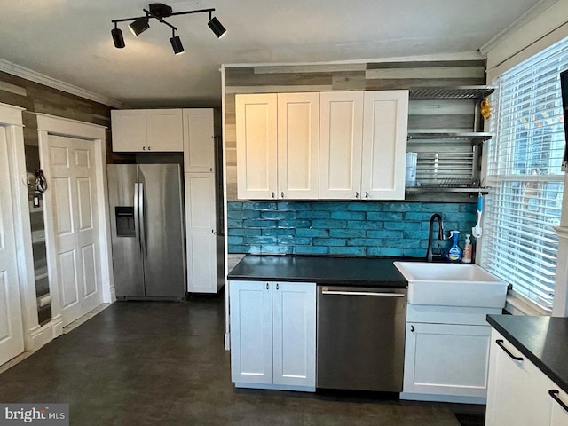 kitchen featuring crown molding, sink, white cabinetry, and stainless steel appliances