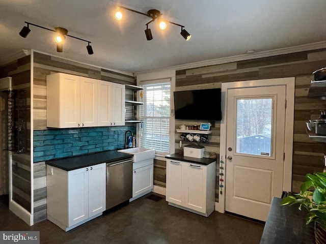 kitchen with dishwasher, crown molding, white cabinetry, and sink