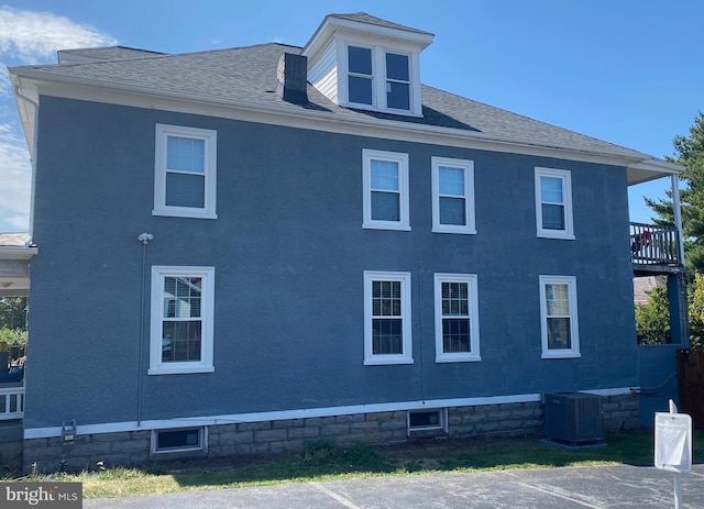 view of side of property featuring cooling unit