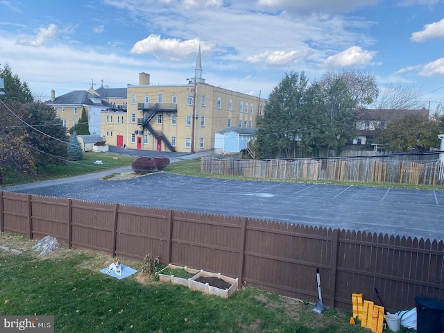 view of pool with a lawn