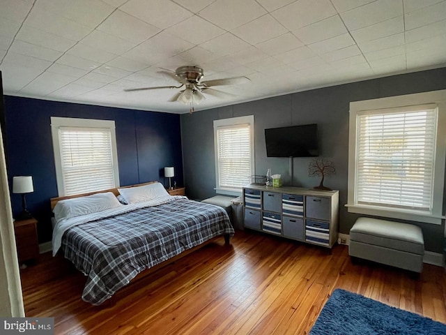 bedroom featuring dark hardwood / wood-style flooring and ceiling fan