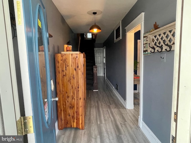 hallway featuring wood-type flooring