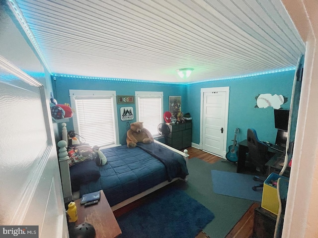 bedroom with wood-type flooring