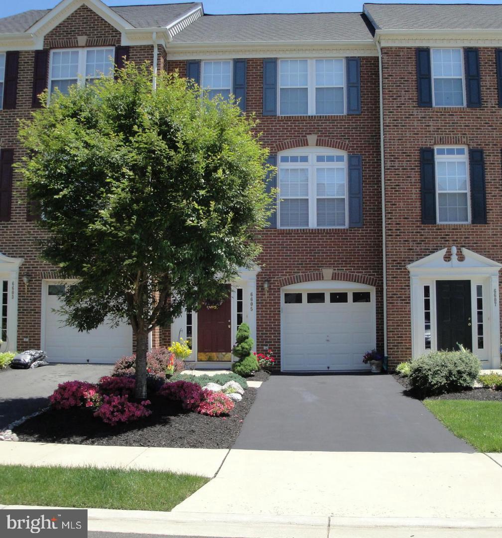 townhome / multi-family property featuring a garage